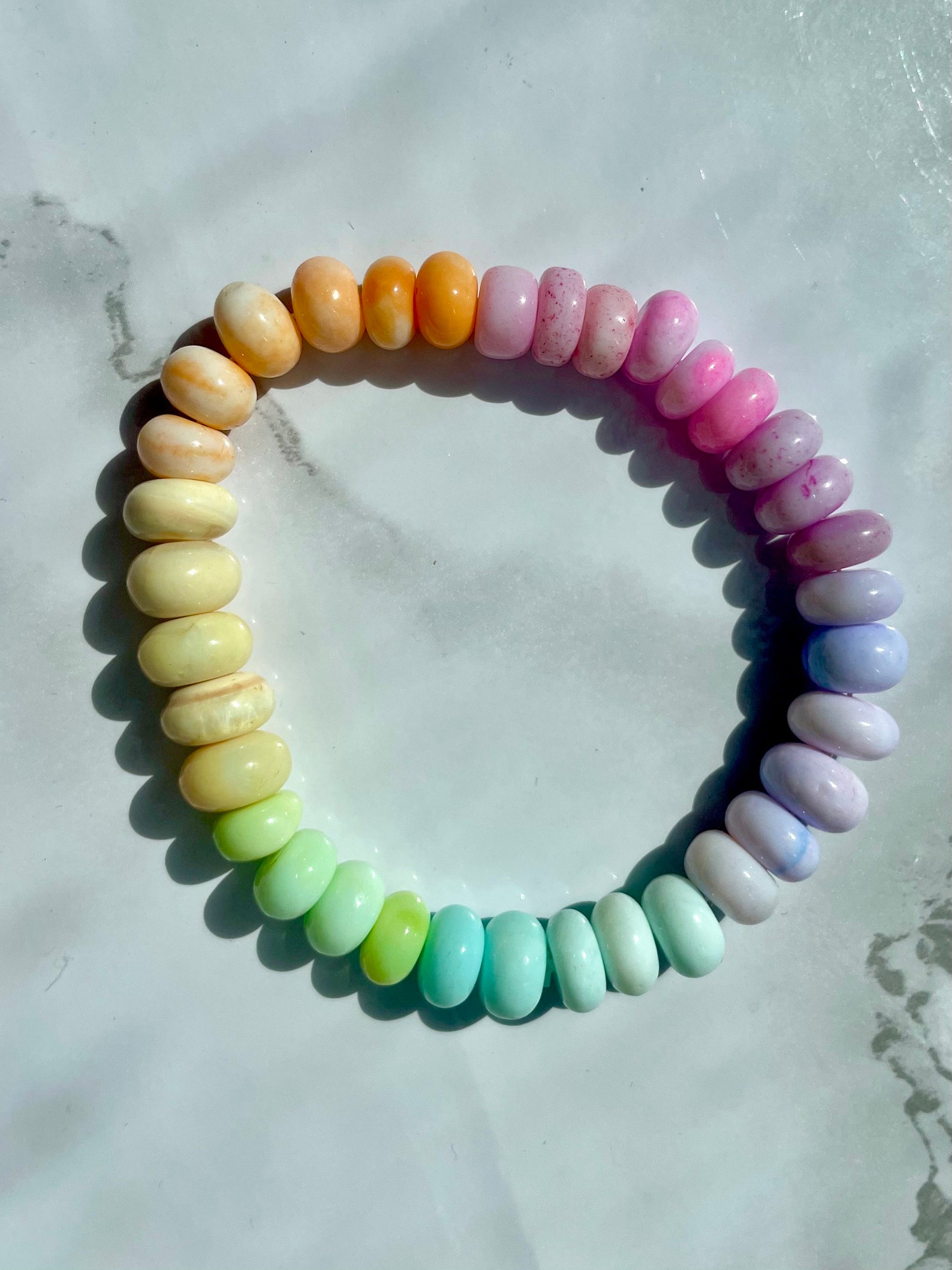 Pastel opal gemstone candy bracelet in sunlight